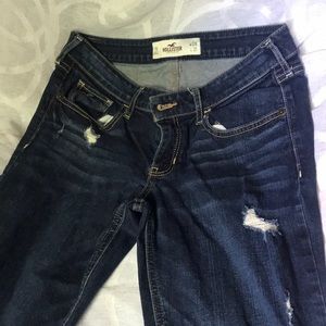 Dark wash jeans with some rips
